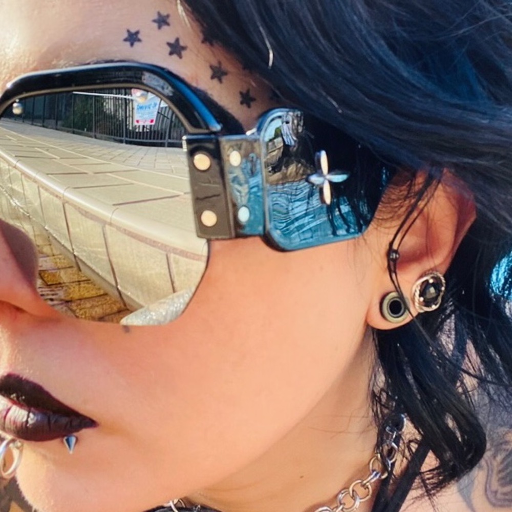 Black sunglasses with side way cross + black studded pouch